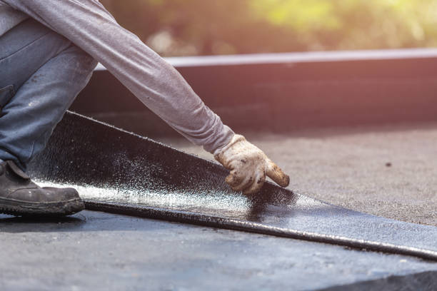 Professional Basement Waterproofing technician working in Romulus, NY